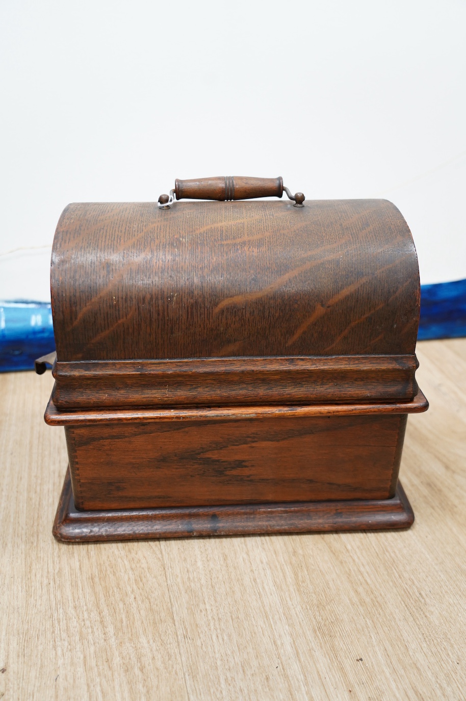 An oak cased Edison phonograph with ten rolls and a small table top polyphon with twelve 8 inch discs (2). Condition - fair to good.